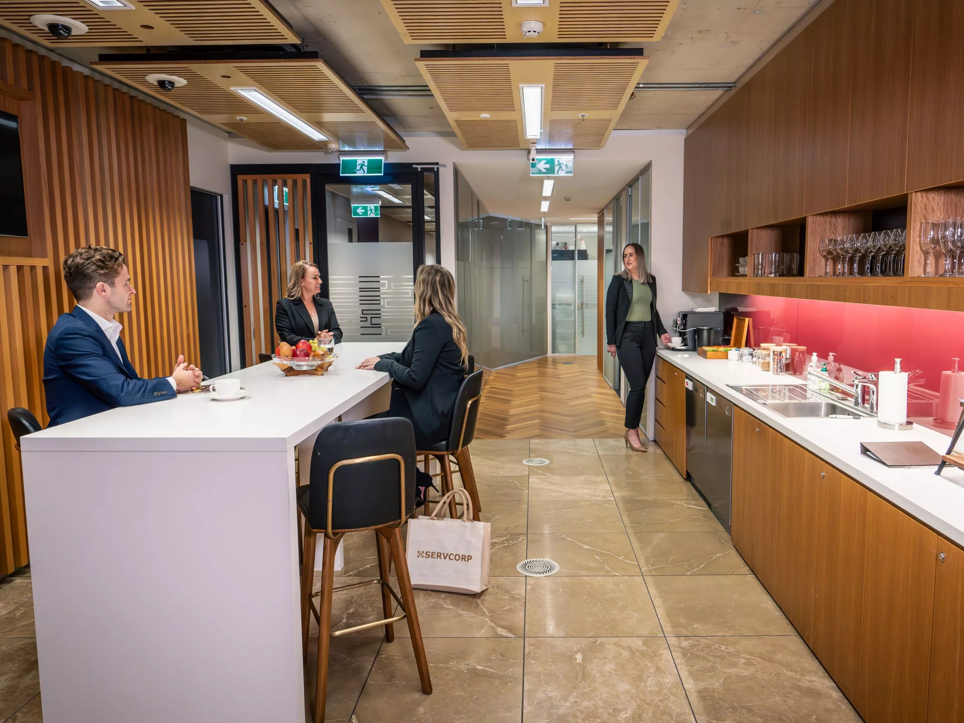 Clients enjoying the fully stocked kitchen in Servcorp Nishi Building, Canberra