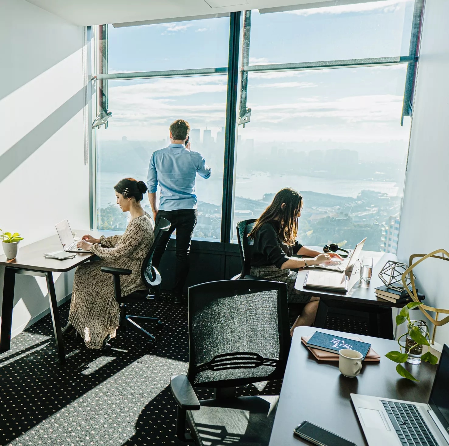 close up on people working in a service office room private space in Barangaroo, tower 1