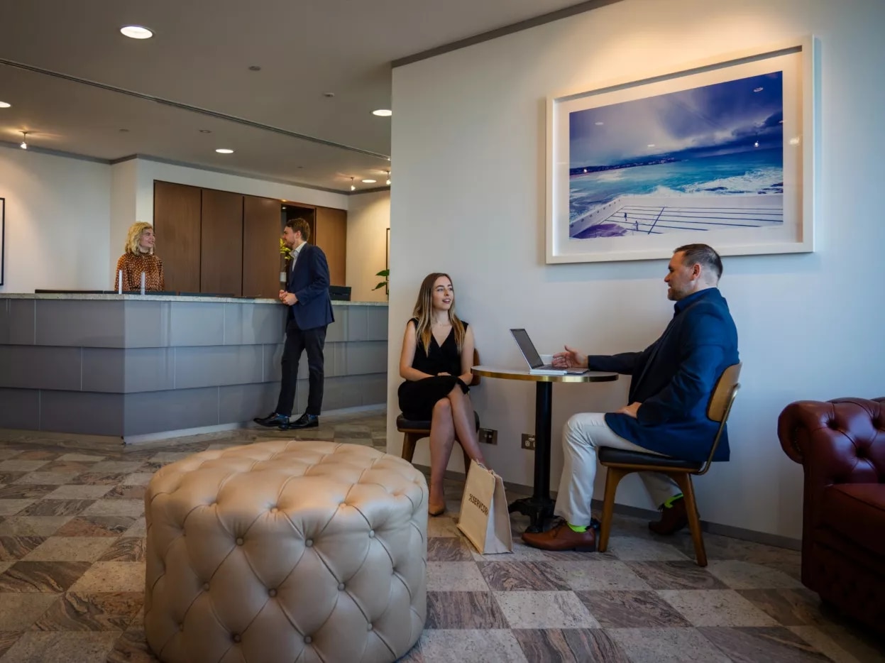 Clients working in a modern coworking space in Servcorp Westfield Tower 2