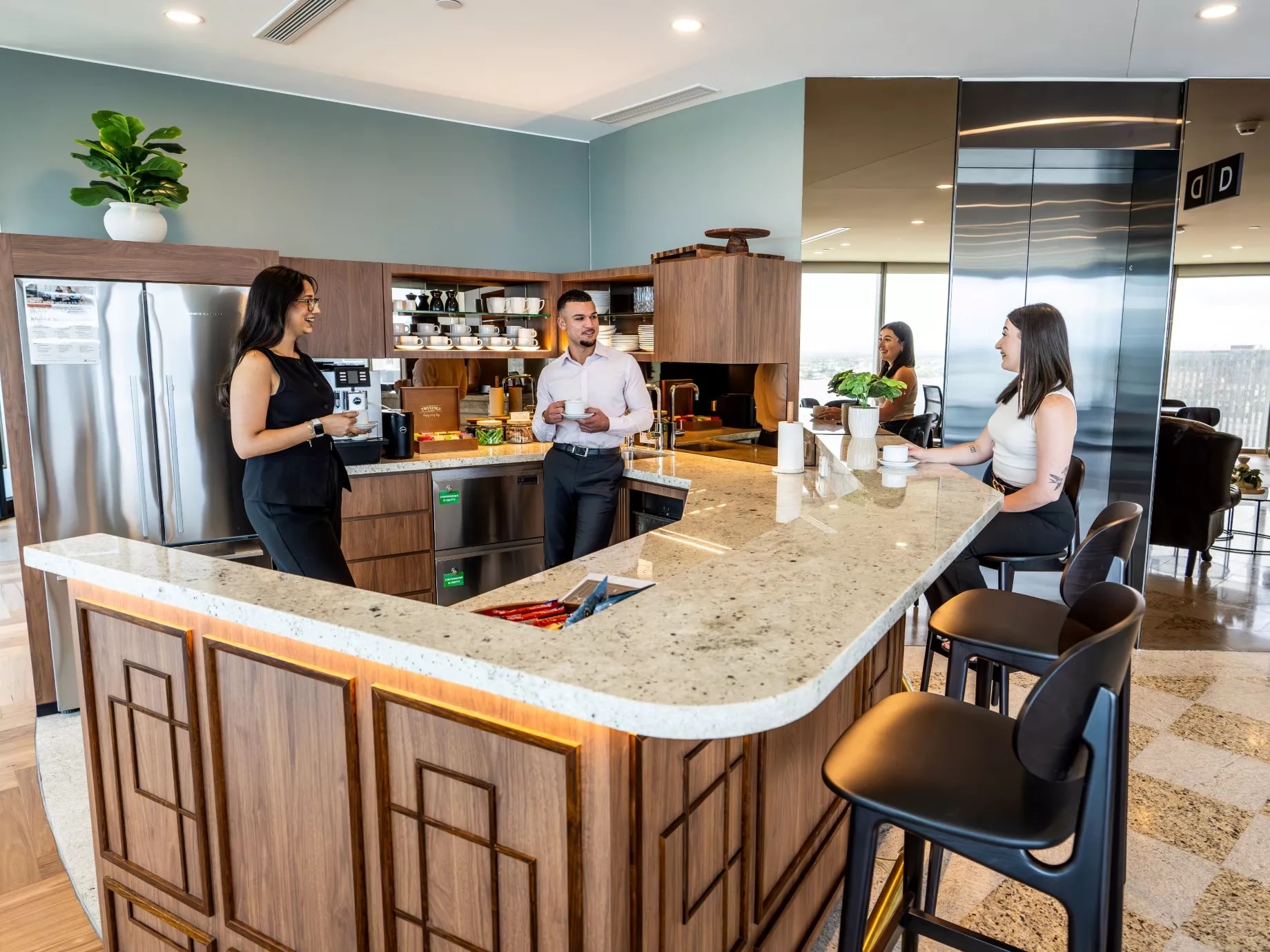 Clients enjoying the fully stocked kitchen in Servcorp Capital Square Tower 3 Perth